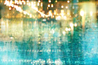 a blurry image of a pool with lights in it